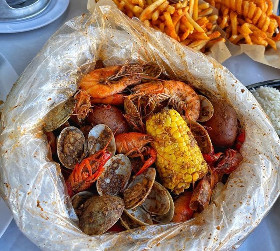 Thai and seafood dishes arranged on a table.