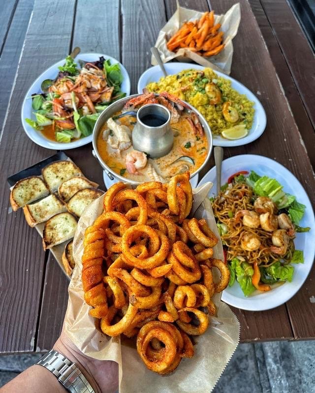 Thai dishes listed beside seafood boil options.